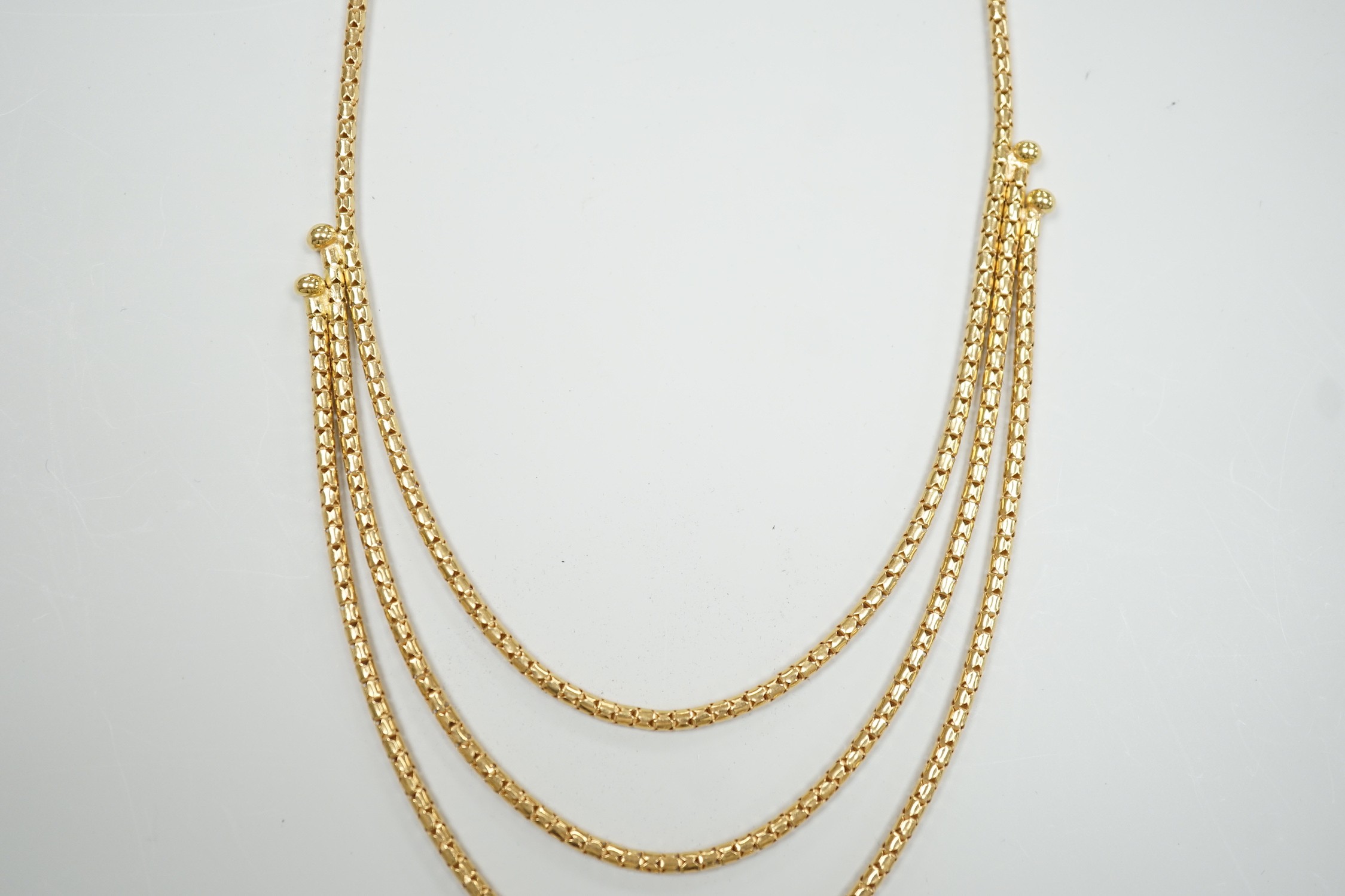 A modern 18ct gold three strand necklace, 43cm, 15.5 grams.